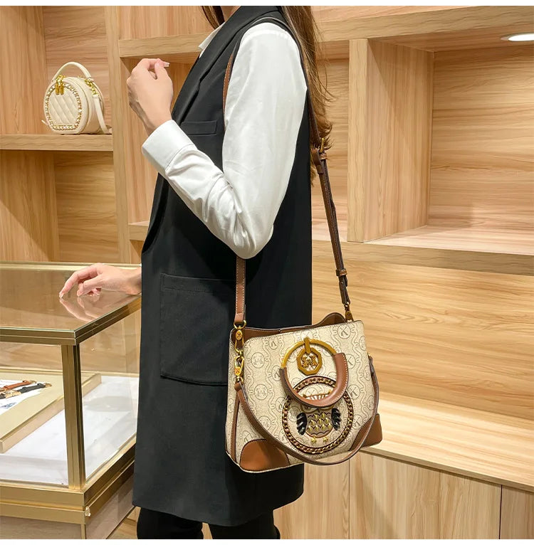 Women's handbag, genuine leather carrying bucket bag, new 2025 high-end design, fashionable single shoulder crossbody bag